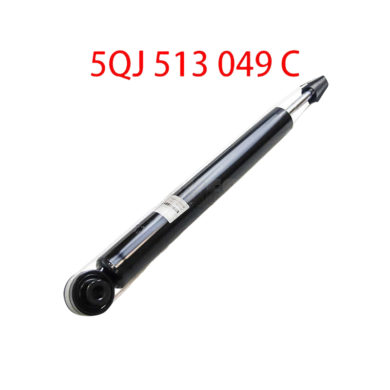 How does the rear shock absorber ensure tire grip when a vehicle is cornering?